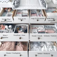 the drawers are organized with baby clothes and other things to put in them for storage