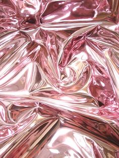 shiny pink material is shown in close up