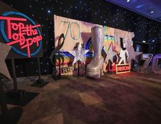 the stage is set up for an event with giant boots and stars on it's side