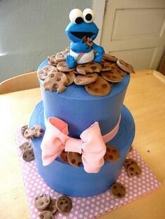 a cookie monster on top of a blue cake