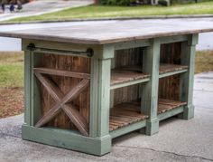 an outdoor table made out of pallet wood with sliding doors on the top and bottom