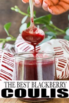 the best blackberry coulis recipe is in a jar with a spoon full of liquid