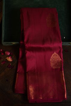 Delivered Within:UK – 3 to 5 working days.Europe – 5 to 7 working days.Canada ,Usa & Asia – 7 to 9 working days.DESCRIPTIONRed Kanchipuram Silk Saree with Simple BorderYarn : Handwoven Pure SilkDesign & Work : LeafColour : RedSaree Material : Kanchipuram Pure SilkBlouse Material :  Kanchipuram Pure SilkBlouse : UnstitchedMEASUREMENTS:Saree Lenght – 5.5 MetersSaree Height : 48”Blouse : 0.75 Meters Attached Silk Blouse Care : Always dry clean for the first wash. For subsequent washes, if dry cleaning is not possible, gently hand wash in cold water with soapnut or silk-suitable detergent or baby shampoo.Always air dry the saree in shade. Never wring the sari or use it in the washing machine or dryer. Never rub the sari vigorously.Do not store silk without dry cleaningExpose the silk f Dark Silk Saree, Hayagrivas Silk Saree, Red Silk Saree Kanchipuram, Kanchipuram Silk Saree Wedding, Onam Saree, Simple Dress Casual, Latest Silk Sarees, Indian Wedding Gowns