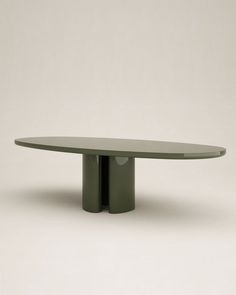 an oval table with two circular bases on each side