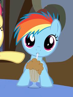 two little ponys standing next to each other in front of a mirror and one is holding a cupcake