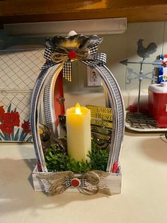 a candle is sitting in a basket on the counter