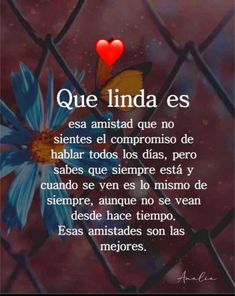 a poem written in spanish on a fence with a blue flower and a red heart