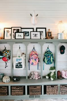 a shelf filled with lots of purses and stuffed animals on top of it's sides