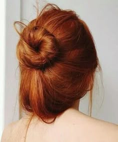 the back of a woman's head with red hair