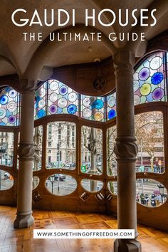 the inside of a building with stained glass windows and wood flooring in front of it