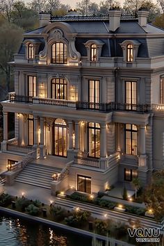 A stunning French chateau with a grand staircase, ornate architectural details, and beautifully illuminated exterior, showcasing luxury and elegance in a classic European style. European Mansion Interior, Grand House Exterior, Classical Home, Luxury Castle, Beautiful Architecture Aesthetic, Castle Home Exterior, Classic House Exterior Luxury, European Mansion Exterior, Chateau Interior