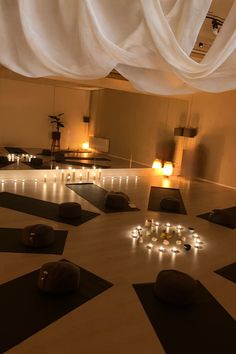 a large room with many candles on the floor