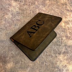 "This custom monogram, PU leather minimalist wallet & card holder can be personalized with any initial(s) you want! Each wallet has a clear ID slot on one side & 2 card slots on the other. The wallet is about 4.1\" wide by 3\" long & would make the perfect gift for those men who don't like to carry around a big, bulky wallet! Each wallet can be personalized using high-quality, heavy-duty heat transfer vinyl (HTV) in multiple different color options. INSTRUCTIONS FOR ORDERING First, choose whethe Personalized Brown Trifold Wallet, Brown Personalized Wallets Perfect For Gifts, Personalized Gift Brown Wallet With Card Slots, Personalized Brown Rectangular Wallet, Brown Leather-lined Card Holder For Everyday Use, Vinyl Gifts, Custom Glitter, Minimalist Wallet, Clip Wallet