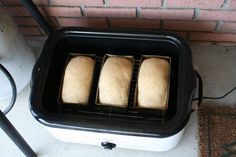 three slices of bread sitting on top of a toaster