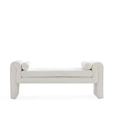 a white bench sitting on top of a white floor