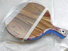 a table tennis racket is wrapped in plastic