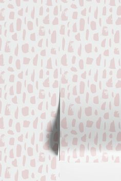 a white and pink wallpaper with different shapes