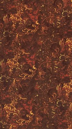 an orange and brown background with gold swirls on the bottom right corner, in very dark colors