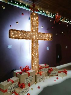 a cross made out of boxes and lights