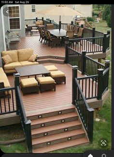 a deck with patio furniture and an umbrella