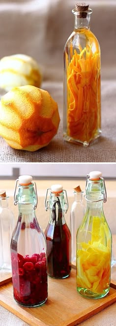 there are three different types of fruit in glass bottles