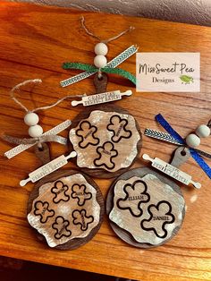 three wooden plaques are sitting on a table with ribbons and tags attached to them that say, my favorite pea designs