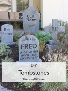 some tombstones that have been placed in front of a house with the words, here lies