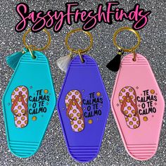 three keychains with flip flops on them and saying sasyfreshings