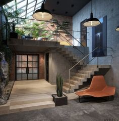 an indoor area with stairs, potted plants and modern furniture