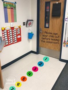 a classroom door with numbers on the floor