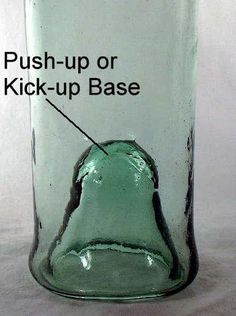 a glass jar with the words push - up or kick - up base