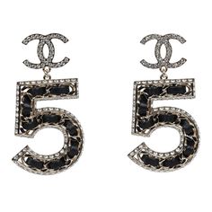 These No 5 drop earrings are in light gold tone metal and feature large N0 5's dangling off small crystal CCs with post back earring closure. Origin: FranceCondition: New and never wornAccompanied by: Chanel box, Chanel pouch, retail UPC and ribbonMeasurements: 2.25" height x 1" width Chanel No 5 Earrings, Chanel Pouch, Chanel Box, Earrings Luxury, Expensive Jewelry Luxury, Black Earrings Dangle, Jewelry Luxury, Chanel Earrings, Chanel Accessories