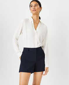 Experience the perfect blend of comfort and style with the Ann Taylor City Shorts in Atlantic Navy. Designed for the modern woman, these shorts are a versatile addition to any wardrobe.

- Size: 14
- Color: Atlantic Navy
- Material: 97% Cotton, 3% Spandex
- Gender: Female
- Fit: Tailored and fitted
- Length: Short length with a 4 1/2" inseam and 25 3/4" leg opening
- Rise: Mid-rise, sits 2 1/4" below natural waist
- Features: Front zip with hook-and-bar closure, belt loops, front off-seam pocket Knitted Suit, City Shorts, Tailored Shorts, Navy Women, Cotton Spandex, Ann Taylor, Modern Woman, Effortless Style, Comfort Fit