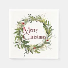 a christmas card with the words merry christmas written in red and green leaves on it