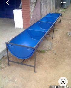 a blue bench sitting in front of a building