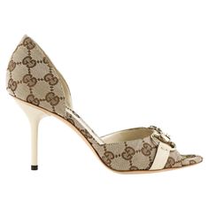 The Gucci pumps are coated in the most popular beige/ebony GG fabric and trimmed in ebony leather trim, thus its neutral style makes it classic for years to come and versatile to go along with most your outfits in the closet. It would be just a very simple and ordinary pump if not for the light gold horsebit at front which greatly accents up the sumptuousness as well as sophistication of the whole design and completes the timeless design of this pair. Gucci GG Horsebit D'Orsay Peep-toe Pump, Bei Luxury Cream Heels With Leather Sole, Elegant Beige Gucci Heels, Designer Beige Heels With Contrasting Heel Counter, Gucci Beige High Heels, Luxury Beige Heels With Contrasting Heel Counter, Gucci Beige Round Toe Heels, Designer Cream Heels With Leather Sole, Gucci Beige Leather Heels, Chic High Heels