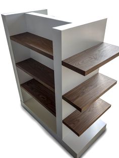 the shelves are made out of wood and white