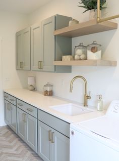 the kitchen is clean and ready to be used as a washer and dryer