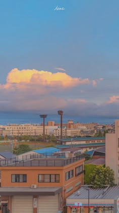 the sky is pink and blue in this cityscape photo, with some buildings on either side