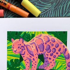 a drawing of a pink leopard with green leaves and orange crayons next to it