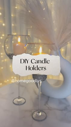 a candle holder with two wine glasses and a sign that says diy candle holders