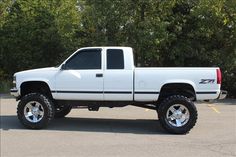 a white truck parked in a parking lot