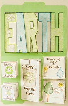 the word earth is written in green and white on a bulletin board with pictures of different things