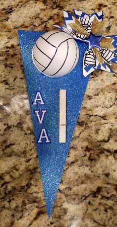 a blue pennant with a volleyball on it and the word ava written in white letters