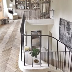 a staircase in a house with pictures on the wall