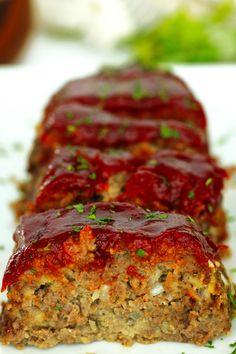 meatloaf with sauce and herbs on a plate