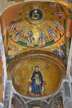 the interior of an old church with paintings on it