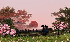 two people standing in the grass near some trees with pink flowers on them and an orange sun behind them