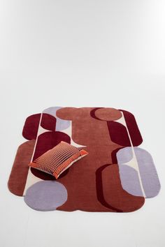 an area rug with various shapes and colors