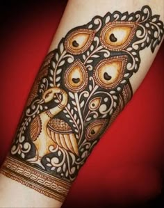 an ornate tattoo design on the arm